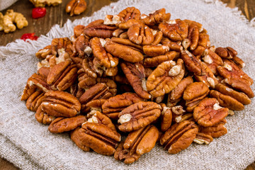 peeled pecan on wooden background