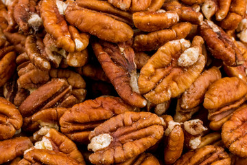 peeled pecan on wooden background