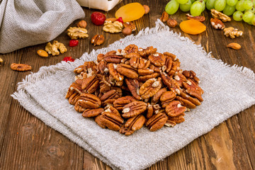 peeled pecan on wooden background