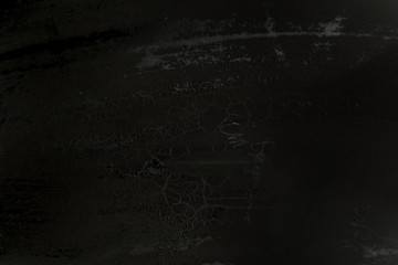 black grunge textured surface background 