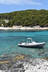 Fototapeta na wymiar Croatian seascape with island and boats, Hvar Island, Dalmatian Coast, Croatia, June, 2018