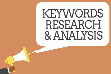 Conceptual hand writing showing Keywords Research and Analysis. Business photo showcasing search for data and create tables graphs Man holding megaphone speech bubble message speaking loud.