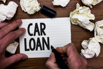Word writing text Car Loan. Business concept for taking money from bank with big interest to buy new vehicle Man holding marker notebook page crumpled papers several tries mistakes.