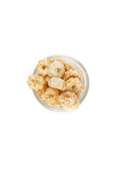 Piles of pale whole grain children's puffed cereal snack