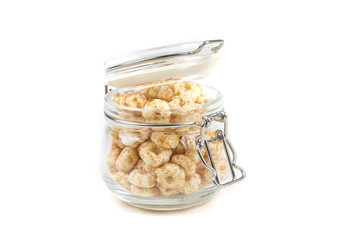 Piles of pale whole grain children's puffed cereal snack