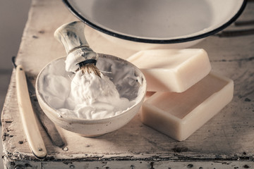 Vintage shave tools with foam, razor and brush