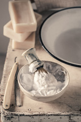 Antique shave tools with grey soap, razor and brush