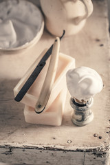 Antique tools for shave with foam, razor and brush