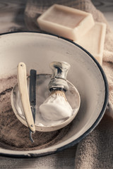 Old tools for shave. Sharp razor, soap and brush