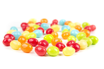 Pile of chewy multicolored shiny gummy candy beans