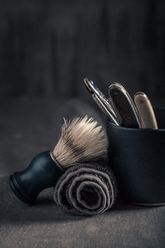 Old barber equipment with foam, razor and brush