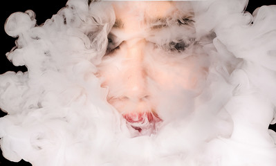 creative of art woman portrait and smoke in face. portrait and smoke on black background.