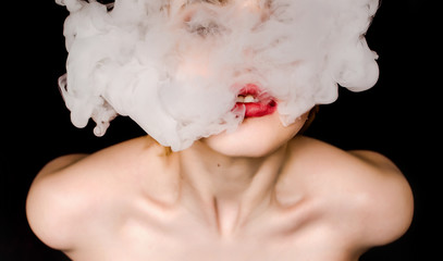 creative of art woman portrait and smoke in face. portrait and smoke on black background.