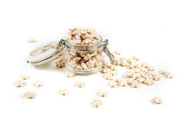 Piles of pale whole grain children's puffed cereal snack