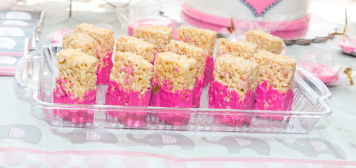Rice Crispy Treat Close Up:  Rice crispy treat close up on display at a baby shower for an expected girl.