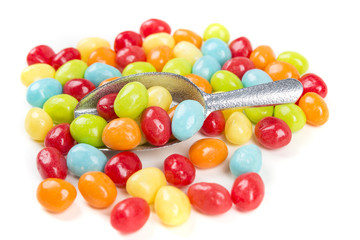 Pile of chewy multicolored shiny gummy candy beans