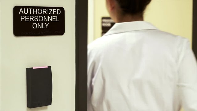 Doctor Scans ID Card to Open a an Authorized Personnel Only Door