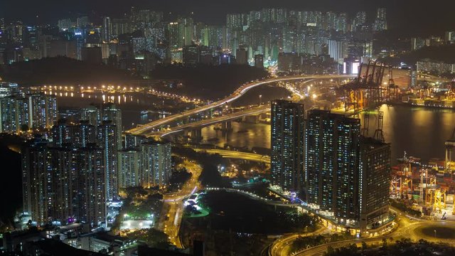 Night time lapse panorama to the residential and port area of Hong Kong