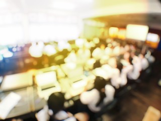 Blurred image of group of students are learning and lecture and using computer together in classroom for study and workshop in computers room at school. education technology or training concept.