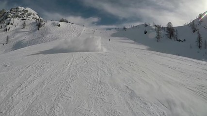 Superslowmotion of swirl up powder snow through stopping skies