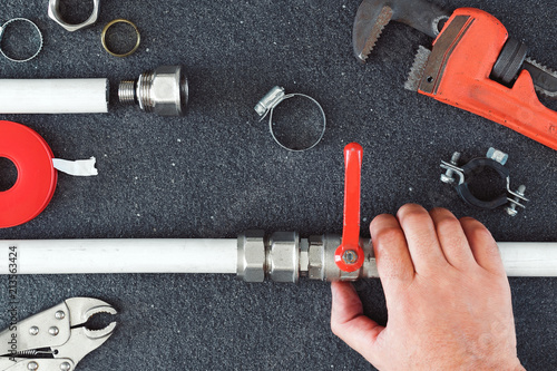 Repair Plumbing Background Hand Plumber Holding Faucet Tools For