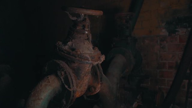 Old rusty valve in an old factory