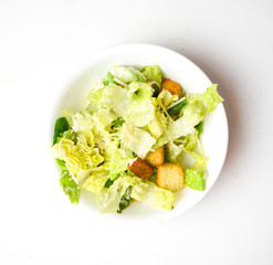 Caesar salad without chicken in a circular white bowl