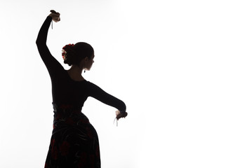 silhouette of spanish girl flamenco dancer on a light background. free space for your text - obrazy, fototapety, plakaty