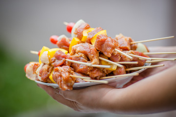 Grilling food, shrimp, on a charcoal stove. Makes the food taste a pleasant aroma. Most will cook themselves at home or at a restaurant.