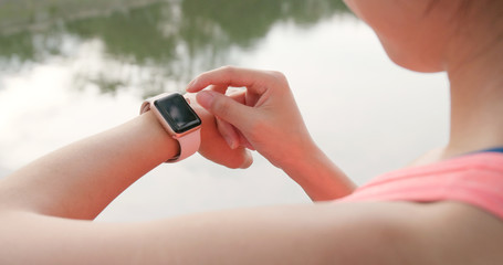 Woman record on smart watch for the sunning data