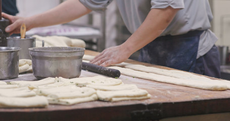 Master making grill sesame bread in restaurant