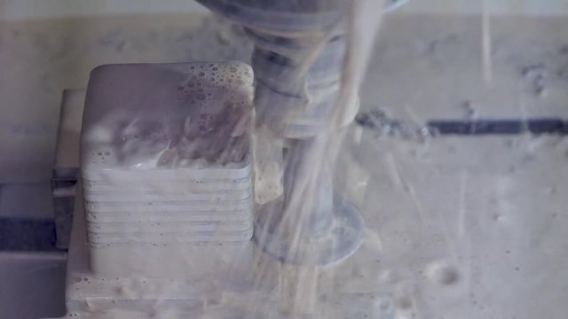 CNC milling an aluminium cube with a custom built "T" mill with a 2mm disk