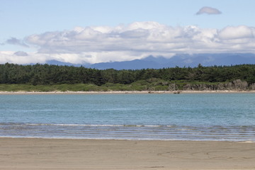 Landscape view of the Manawatu River Estuary at Foxton Beach, with the Tararua Ranges in the background.
