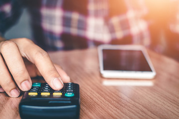 Business people are calculating the cost of doing business.