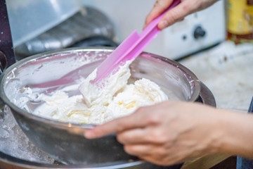 whipped cream cooking process.woman mixing Fresh cream for making whipped cream or desserts and bekery.woman making whipped cream and show process with stand or hand mixer.