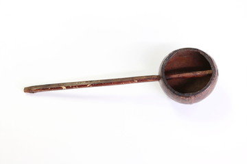 a deep spoon made of coconut shell. a dipper Thailand  isolated on white background. 