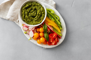 Healthy snack Raw vegetables pesto sauce copy space top view Vegetarian healthy food