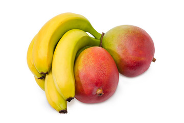 Two whole mango fruit and cluster of bananas
