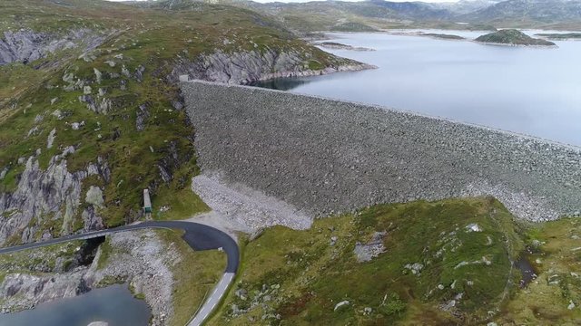 Aerial footage of a large stone dam for a Hydroelectric power station POI