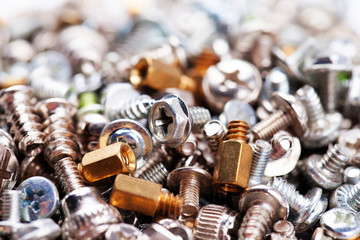 Computer screws background, hardware, bolts, nuts, selective focus