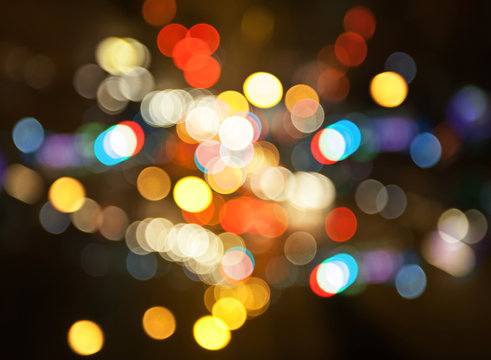 Night city street lights colorful bokeh background, darkness concept