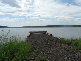  old pier on the shore of a pond