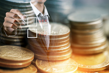 Businessman with money in hand, US dollar, Rows of coins for finance and Saving concept