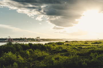 Obraz premium Amur river at cloudy sunset