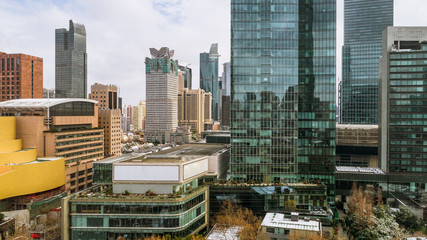 Fototapeta premium aerial view of downtown Shanghai near Jing An Temple and Nanjin Road after an unusual snowfall in the morning