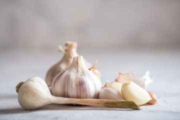 Group of garlic cloves scattered on a white background. Important ingredient in different cuisines. A healthy product.