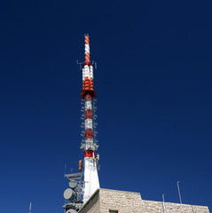 Mobile telecommunication tower or cell tower with antennae and electronic communications equipments