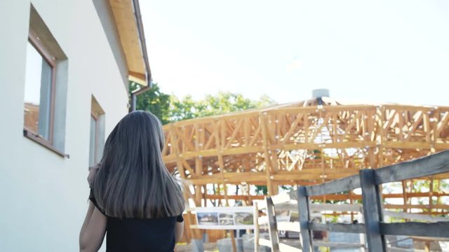 The young girl running with good mood at stable. 4K