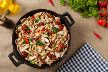 Whole-grain tagliatelle pasta with grilled chicken.