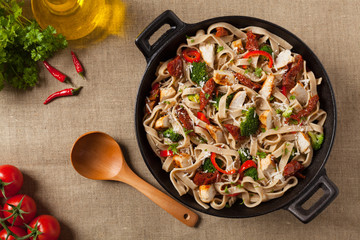 Whole-grain tagliatelle pasta with grilled chicken.